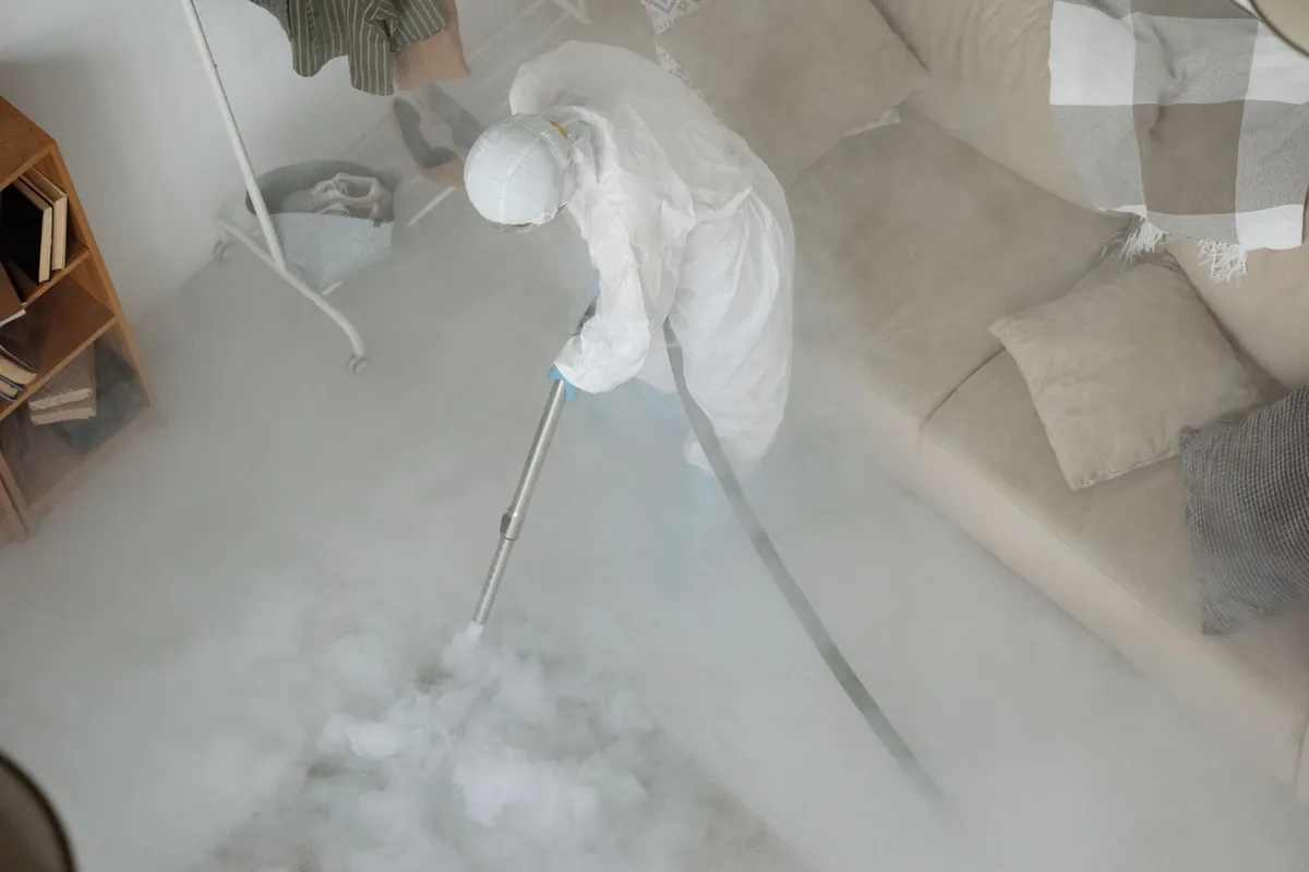 Biohazard cleanup technician in protective equipment, West Jordan, UT